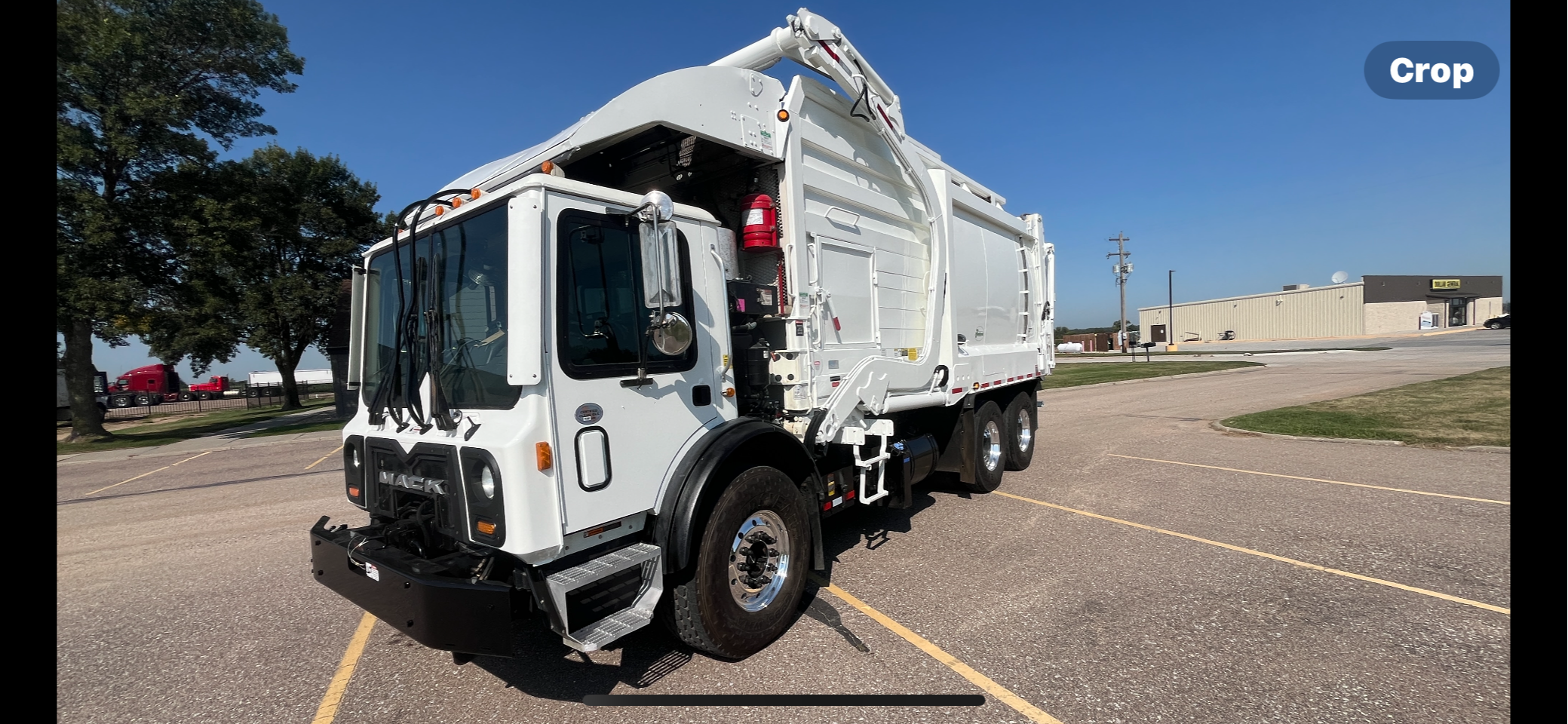 2018 MACK MRU FRONTLOADER WITH HEIL 1/2 PACK BODY